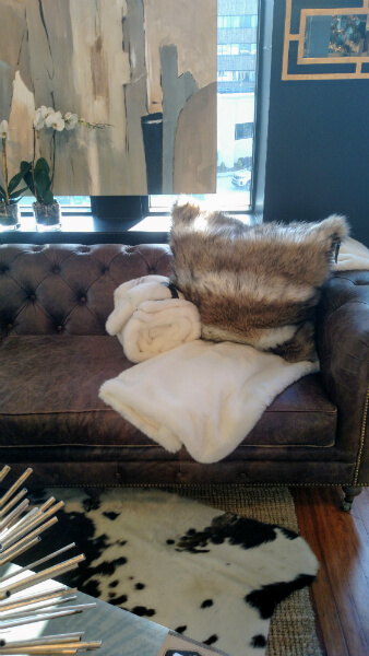 Leather sofa and throw