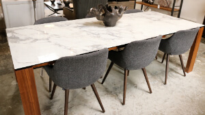 Marble table top with wood legs and wool chairs